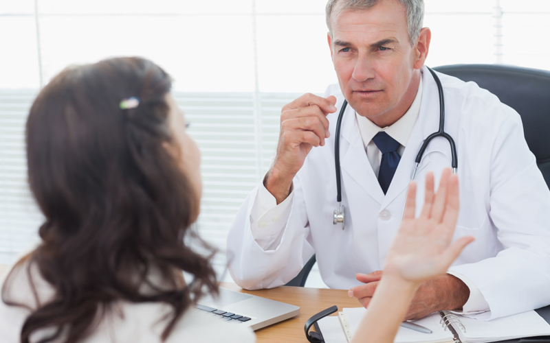 woman talking to a doctor